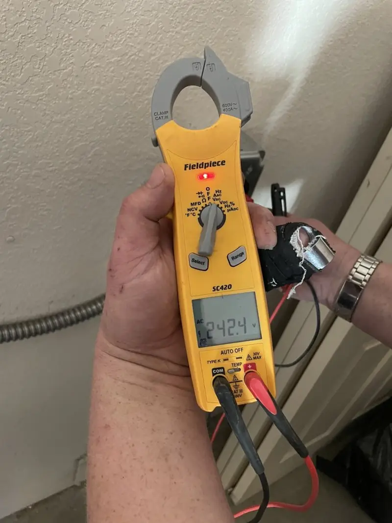 Voltage testing with clamp meter during Whole House Surge Protector in Trumbull